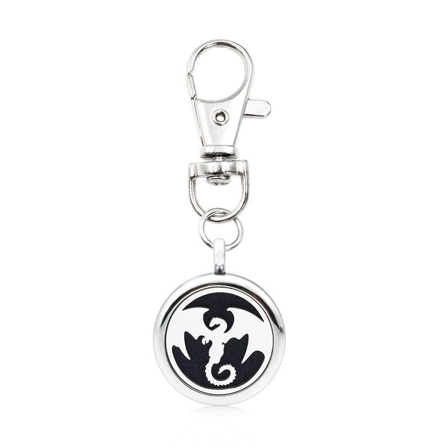 Wholesale Alloy Angel Wings Hollow Aromatherapy Essential Oil Keychain